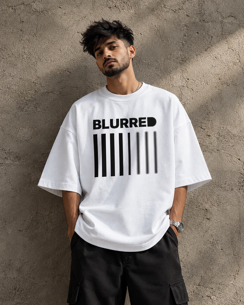 White Blurred oversized t-shirt front view with bold black barcode graphic and BLURRED typography