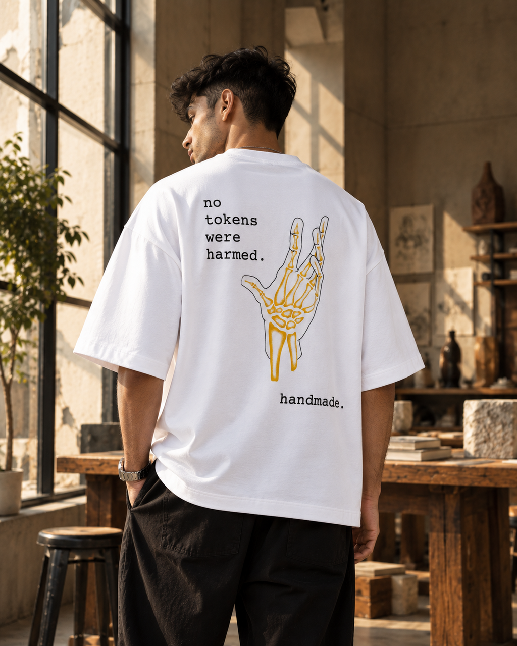 White Crafted Premium Oversized T-Shirt back view with skeleton hand artwork and handmade typography