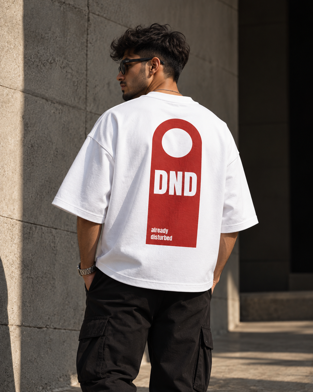 White DND oversized t-shirt back view featuring DND already disturbed door hanger graphic