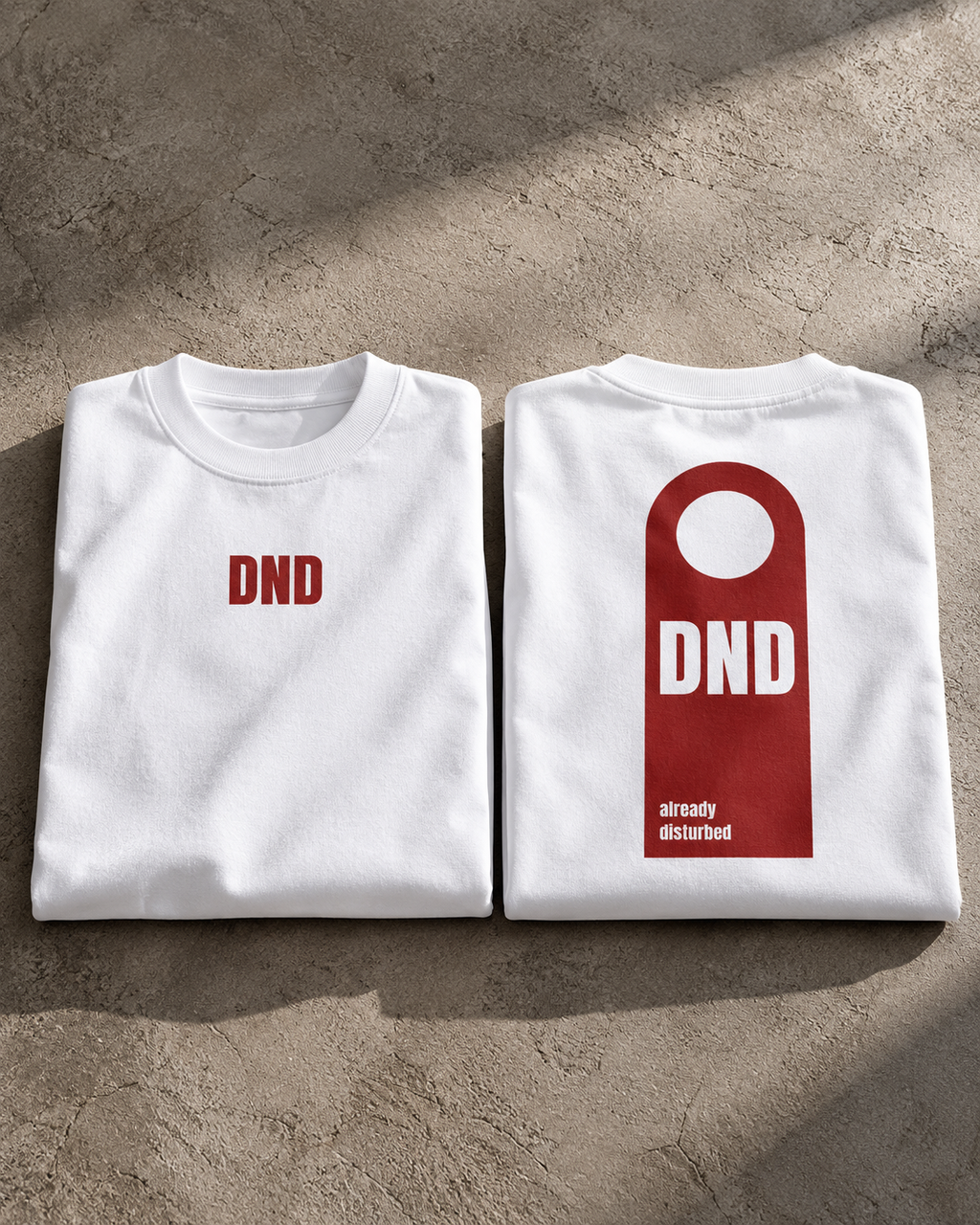 White DND oversized t-shirt hero view featuring DND front and already disturbed back graphic