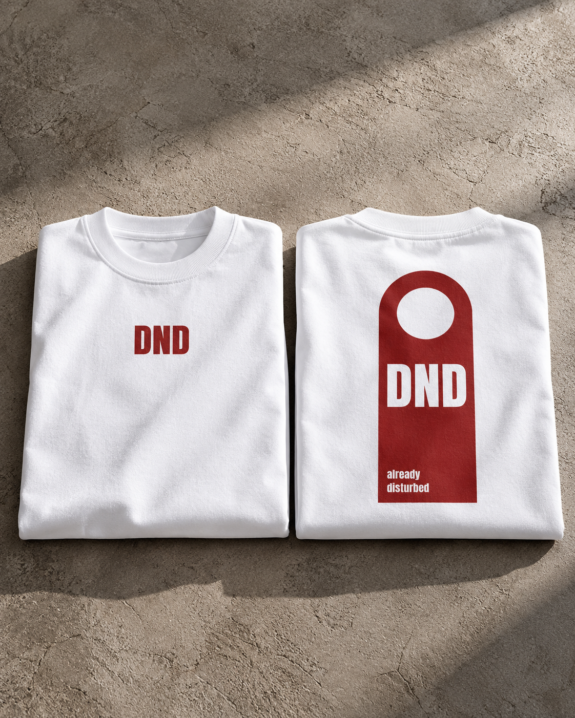 White DND oversized t-shirt hero view featuring DND front and already disturbed back graphic