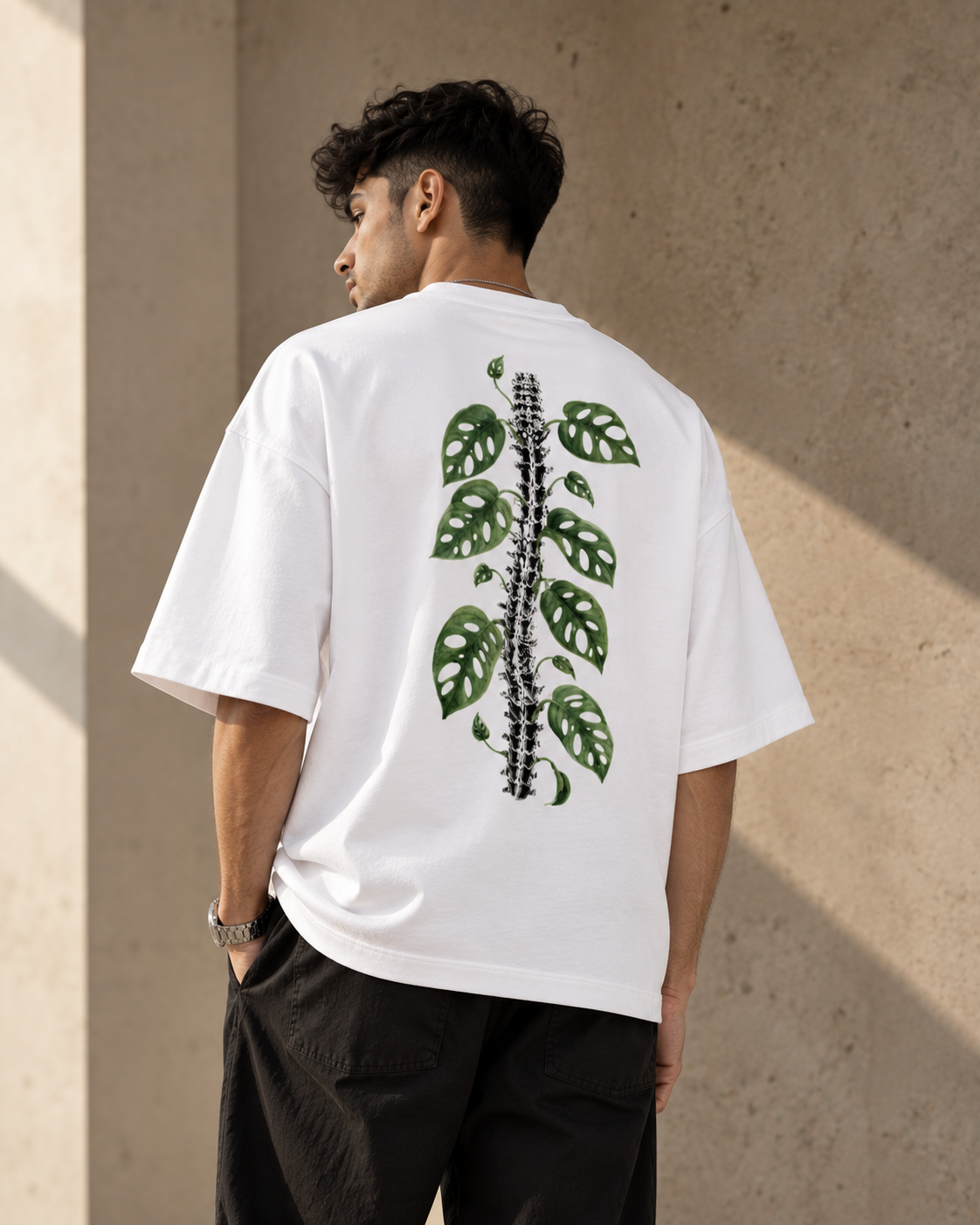 White Leaf Premium Oversized T-Shirt back view with green botanical leaf and stem artwork
