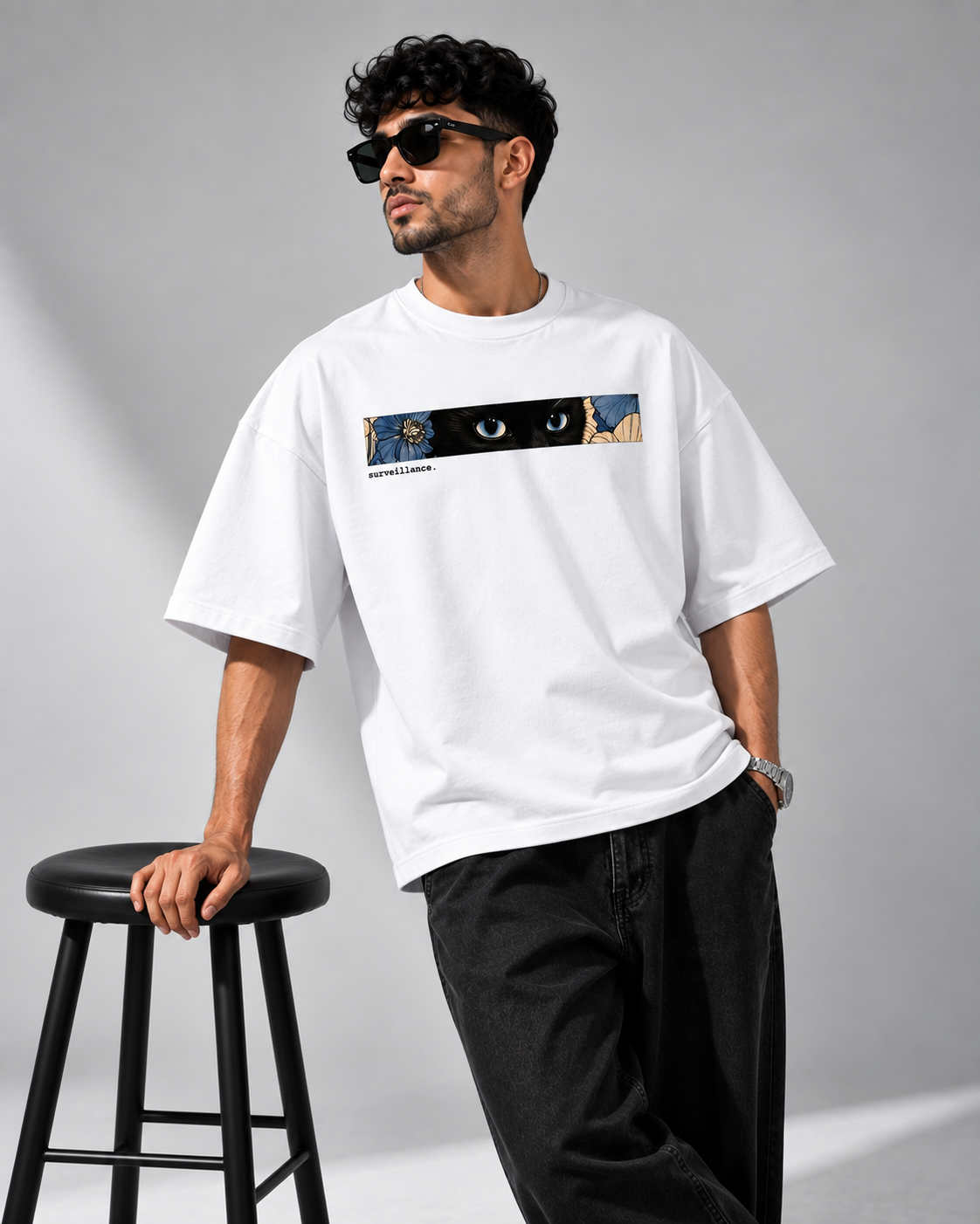 White Surveillance Premium Oversized T-Shirt lifestyle view featuring blue floral eye artwork